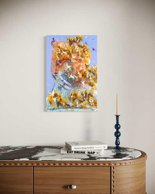 A Good Place to Land by Adam Bogusz shown at an angle on a pale wall above a fluted timber sideboard with a marble top, styled with books and a blue glass candlestick, to indicate scale.