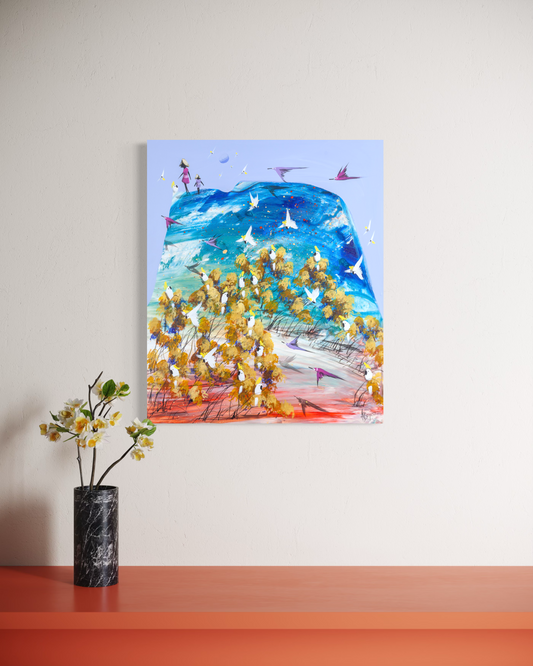 Taking Turns by Adam Bogusz hanging on a white wall in a room with a burnt orange shelf and a black marble vase of white blossom below.
