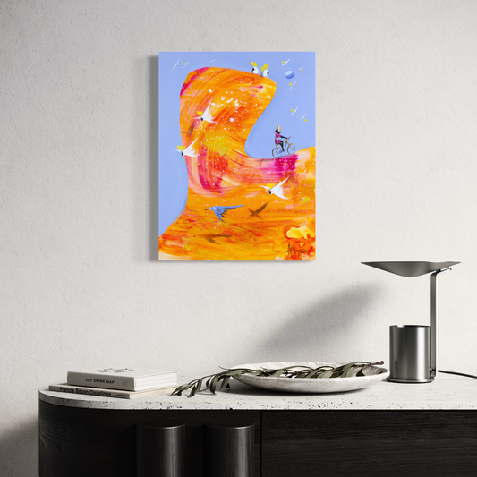 Let It Come by Adam Bogusz hanging above a black console with a stone top, a table lamp, books and a bowl of eucalyptus leaves, shown to scale in a living space.