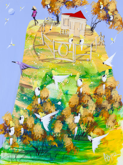When She's Ready, original acrylic painting on board by Adam Bogusz. Green and gold hillside against a soft blue sky, with a red roofed house behind a fence and ornate gate, two cockatoos perched on the gate, a woman in pink walking just outside the fence line and sulphur crested cockatoos gathered in golden trees below.