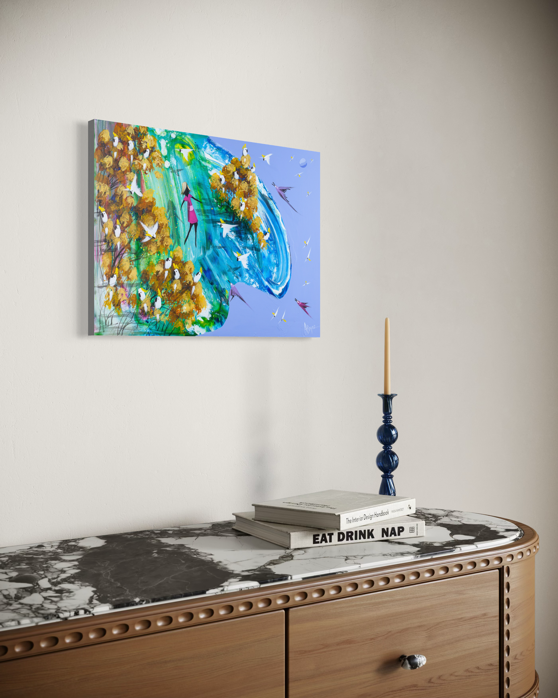 Somewhere In Between by Adam Bogusz hanging unframed on a pale wall above a marble topped timber sideboard, seen at a slight angle so the depth of the painted board is visible.