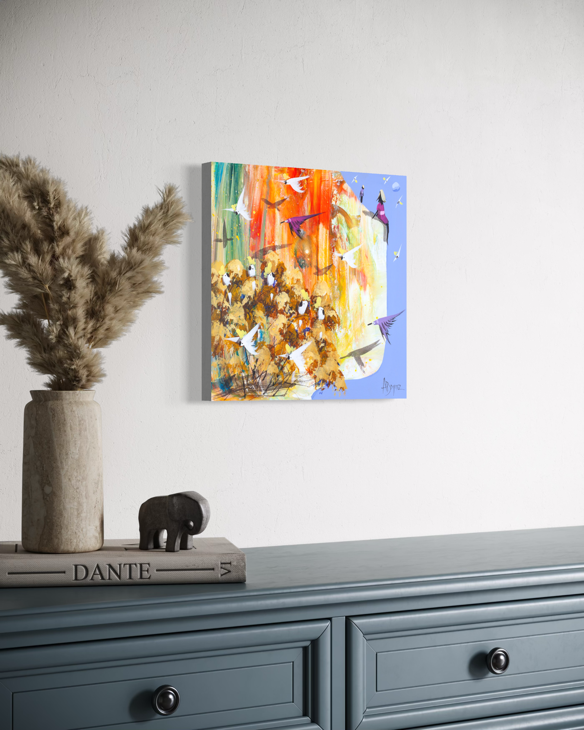 Side view of Nothing to Catch by Adam Bogusz, showing the painted edge of the MDF board as it hangs on a white wall above a blue grey dresser with dried pampas grass and a small elephant ornament.