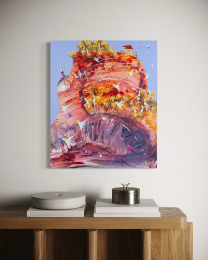 The Wiggly World by Adam Bogusz, 60 x 50 cm painting on MDF board hanging above an oak sideboard with white books, a pale ceramic dish and a metal canister, showing a swirling red and purple hill crowned with golden trees full of cockatoos.