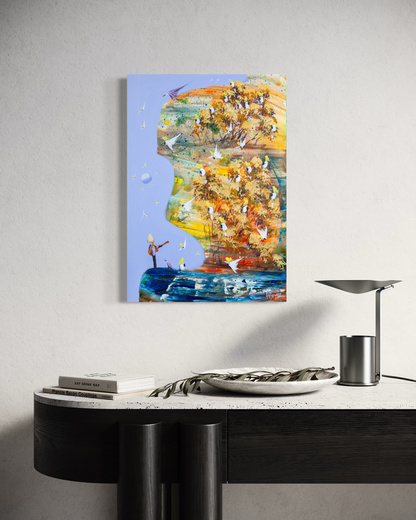 His Own Song by Adam Bogusz, 50 x 35 cm painting on MDF board hanging above a black console with a travertine top, a stone bowl holding an olive branch, books and a metal lamp, showing golden gums full of cockatoos and a small figure playing guitar by the water.