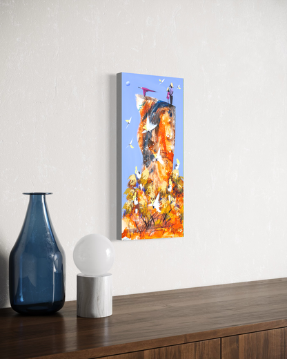 Side by Side by Adam Bogusz hanging unframed on a pale textured wall above a dark timber sideboard with a blue glass bottle and globe lamp, seen at a slight angle so the depth of the painted board is visible.