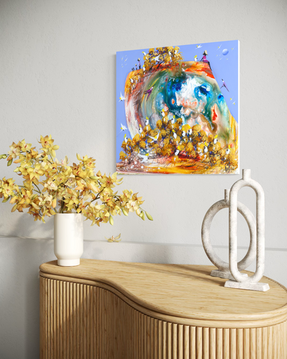 Just for a Moment by Adam Bogusz shown on a pale wall above a fluted timber sideboard with yellow orchids and stone sculptures, to indicate scale.