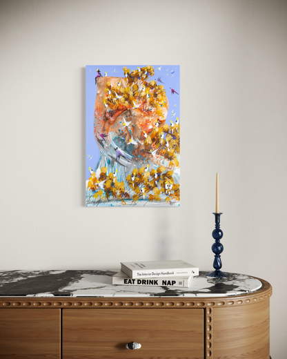 A Good Place to Land by Adam Bogusz shown at an angle on a pale wall above a fluted timber sideboard with a marble top, styled with books and a blue glass candlestick, to indicate scale.