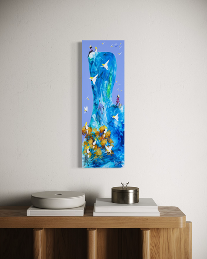 The Same Blue by Adam Bogusz hanging unframed on a pale textured wall above a timber console with books and lidded vessels, showing the scale of the painting in a room.