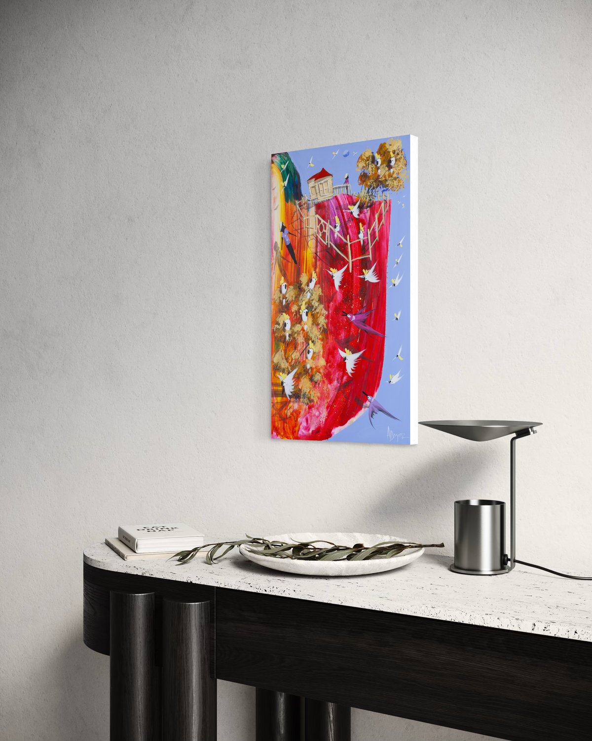 Still in Sight by Adam Bogusz hanging unframed on a pale wall above a black and travertine console, seen at a slight angle so the depth of the painted board is visible.