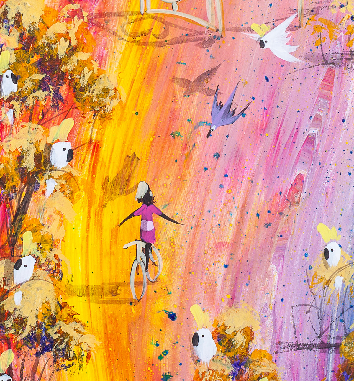 Detail of No Hands by Adam Bogusz, showing a girl in magenta riding a bicycle down a streak of yellow and orange with her arms spread wide, as a purple bird dives past and cockatoos watch from the trees.