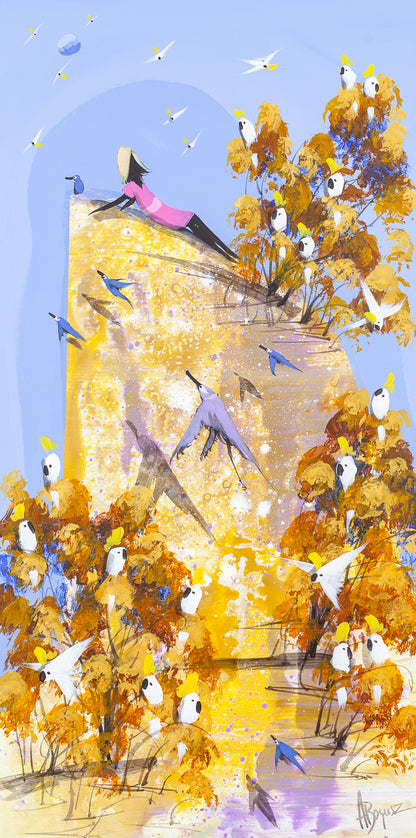Nowhere to Be, original acrylic painting on board by Adam Bogusz. Tall golden landscape under a soft blue sky, with a woman in a pink dress lying back on a sunlit rock while sulphur crested cockatoos gather in ochre and rust trees and blue birds fly across the light.