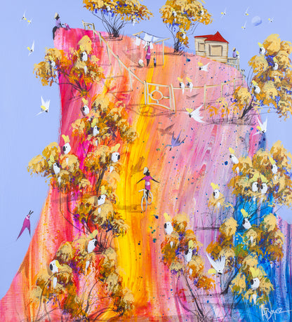 No Hands, original acrylic painting on board by Adam Bogusz. A steep hill poured in pink, orange and gold under a soft blue sky, lined with ochre trees full of sulphur crested cockatoos, with a girl in magenta riding a bicycle down the middle with her arms out wide, and a red roofed house, a washing line and a figure sitting on the cliff edge at the top.