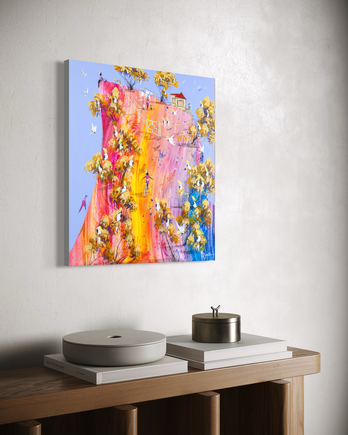 Angled view of No Hands by Adam Bogusz on a white wall above a timber sideboard, showing the depth of the board edge.